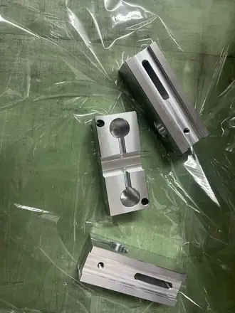 Milled steel blocks with slotted profiles