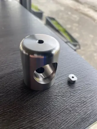 Turned cylindrical housing with cross-bore