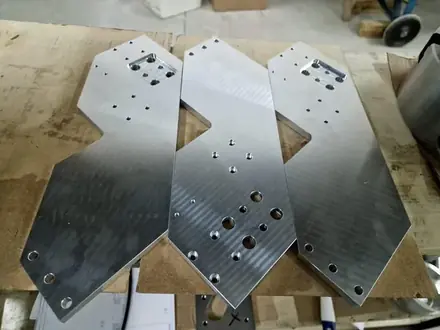 Profile-cut steel plates with drilled holes